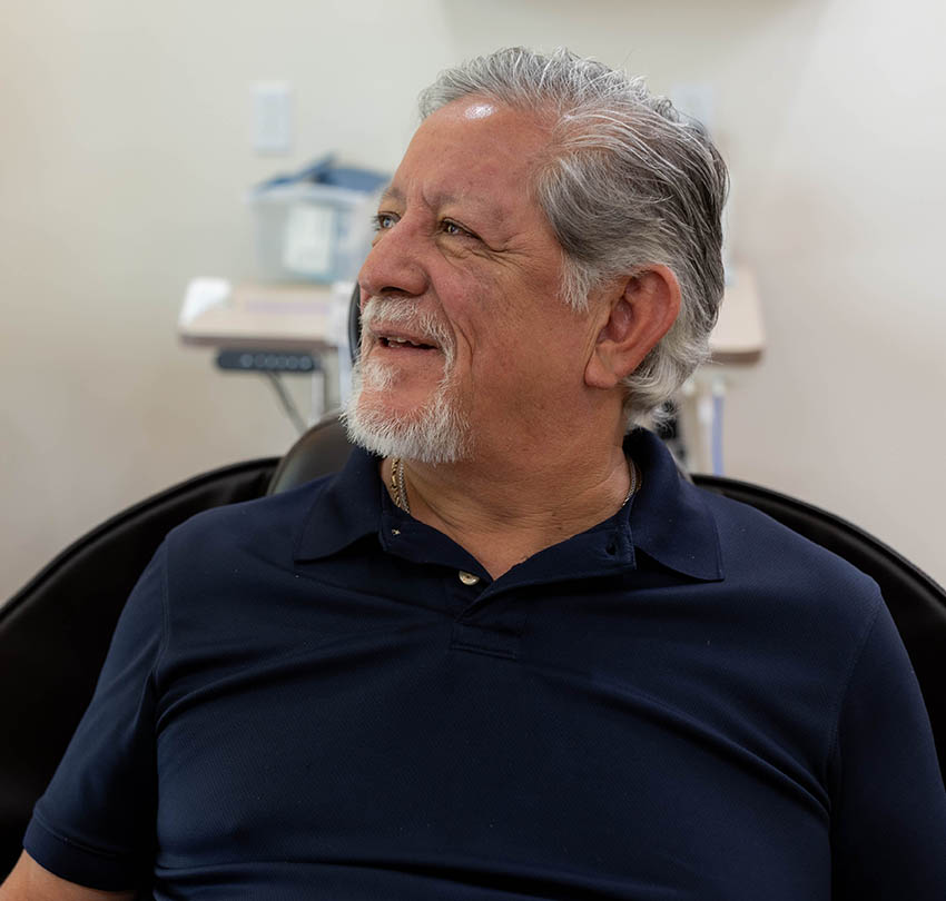 Patient seated in a dental treatment chair