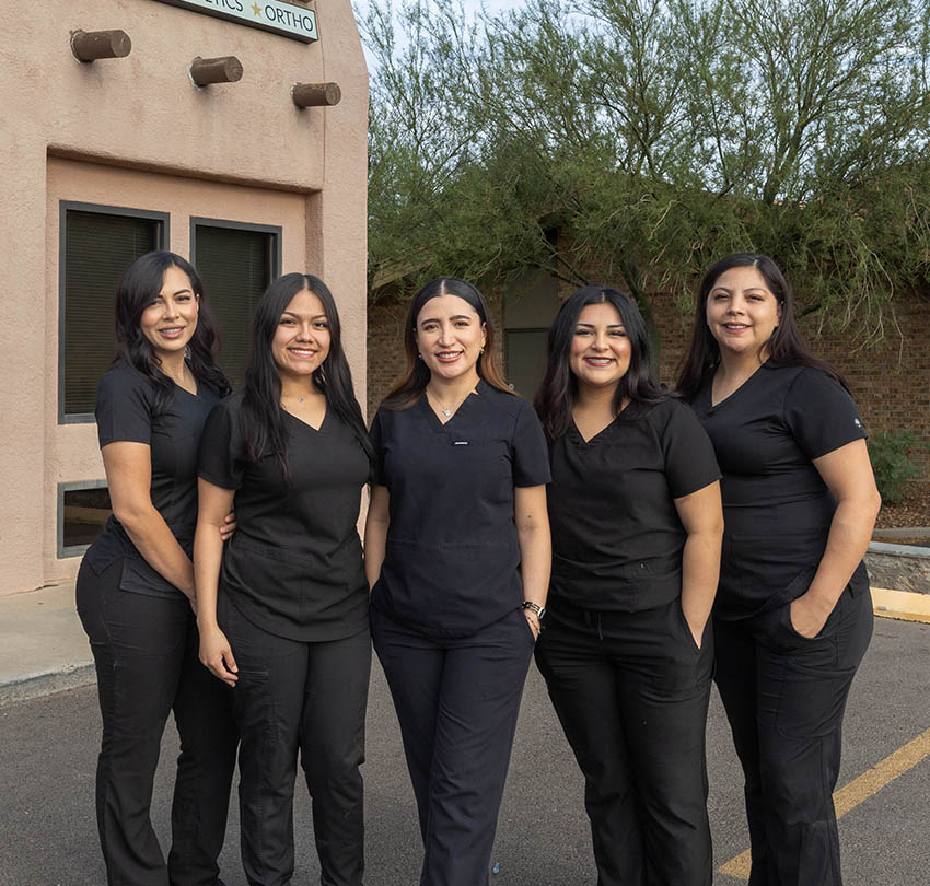 Five dental team members standing outside the City View Dental office